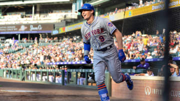 DENVER, CO - JUNE 18: Brandon Nimmo #9 of the New York Mets smiles as he celebrates after scoring on a first inning inside-the-park homerun against the Colorado Rockies at Coors Field on June 18, 2018 in Denver, Colorado. (Photo by Dustin Bradford/Getty Images)