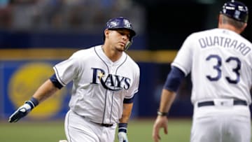 ST. PETERSBURG, FL - JUNE 25: Wilson Ramos #40 of the Tampa Bay Rays is congratulated by third base coach Matt Quatraro #33 after his home run in the sixth inning of a baseball game against the Washington Nationals at Tropicana Field on June 25, 2018 in St. Petersburg, Florida. (Photo by Mike Carlson/Getty Images)
