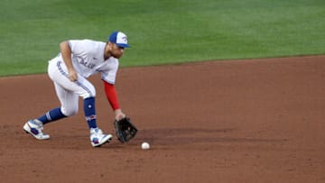 BUFFALO, NEW YORK - AUGUST 25: Brandon Drury #3 of the Toronto Blue Jays fields the ball during the fourth inning of a game against the Boston Red Sox at Sahlen Field on August 25, 2020 in Buffalo, New York. The Blue Jays are the home team and are playing their home games in Buffalo due to the Canadian government’s policy on coronavirus (COVID-19). (Photo by Bryan M. Bennett/Getty Images)