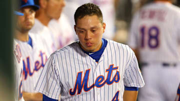 NEW YORK, NY - JULY 29: Wilmer Flores #4 of the New York Mets looks on in the dugout in the ninth inning duirng the game against the San Diego Padres at Citi Field on July 29, 2015 in Flushing neighborhood of the Queens borough of New York City. (Photo by Mike Stobe/Getty Images)