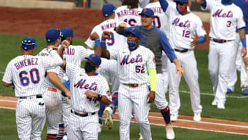 NEW YORK, NEW YORK - JULY 24: Yoenis Cespedes #52 of the New York Mets celebrates a 1-0 win with his teammates against the Atlanta Braves in after their Opening Day game at Citi Field on July 24, 2020 in New York City. The 2020 season had been postponed since March due to the COVID-19 pandemic. (Photo by Al Bello/Getty Images)