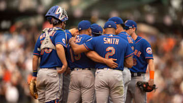 Aug 18, 2021; San Francisco, California, USA; New York Mets manager Luis Rojas (19) confers with his players during the tenth inning against the San Francisco Giants at Oracle Park. Mandatory Credit: D. Ross Cameron-USA TODAY Sports