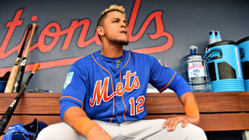 Feb 25, 2019; West Palm Beach, FL, USA; New York Mets center fielder Juan Lagares (12) sits in the dugout between innings of a spring training game against the Houston Astros at FITTEAM Ballpark of the Palm Beaches. Mandatory Credit: Jasen Vinlove-USA TODAY Sports