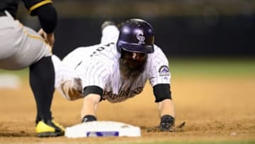 Sep 22, 2015; Denver, CO, USA; Colorado Rockies center fielder Charlie Blackmon (19) heads back to first base in the eighth inning against the Pittsburgh Pirates at Coors Field. The Pirates defeated the Rockies 6-3. Mandatory Credit: Ron Chenoy-USA TODAY Sports