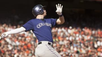 Oct 4, 2015; San Francisco, CA, USA; Colorado Rockies left fielder Corey Dickerson (6) hits a three run home run against the San Francisco Giants during the ninth inning at AT&T Park. Mandatory Credit: Ed Szczepanski-USA TODAY Sports