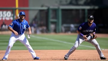 Mar 8, 2016; Surprise, AZ, USA; Kansas City Royals right fielder Paulo Orlando (16) leads off of first base as Colorado Rockies first baseman Ben Paulsen (10) covers the bag during the fifth inning at Surprise Stadium. Mandatory Credit: Joe Camporeale-USA TODAY Sports