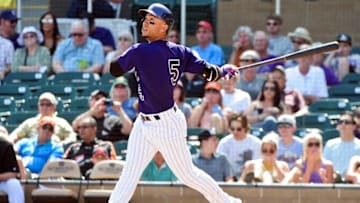 Mar 15, 2016; Salt River Pima-Maricopa, AZ, USA; Colorado Rockies right fielder Carlos Gonzalez (5) flies out in the first inning against the Oakland Athletics at Salt River Fields at Talking Stick. Mandatory Credit: Matt Kartozian-USA TODAY Sports