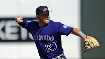 Mar 8, 2016; Surprise, AZ, USA; Colorado Rockies shortstop Trevor Story (27) throws to first base after stepping on second base to complete double play against the Kansas City Royals during the fifth inning at Surprise Stadium. Mandatory Credit: Joe Camporeale-USA TODAY Sports