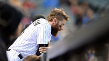 May 23, 2015; Denver, CO, USA; Colorado Rockies center fielder Charlie Blackmon (19) leans over his dugout rail in the ninth inning against the San Francisco Giants at Coors Field. The Giants defeated the Rockies 10-8. Mandatory Credit: Ron Chenoy-USA TODAY Sports