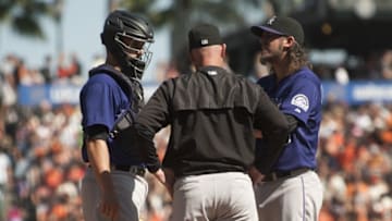 Oct 4, 2015; San Francisco, CA, USA; Colorado Rockies pitching coach Steve Foster (56) visits the mound to speak with Colorado Rockies starting pitcher Christian Bergman (36) during the first inning at AT&T Park. Mandatory Credit: Ed Szczepanski-USA TODAY Sports