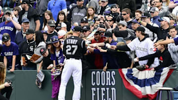 Apr 10, 2016; Denver, CO, USA; Colorado Rockies shortstop Trevor Story (27) signs autographs before the game against the San Diego Padres Coors Field. Mandatory Credit: Ron Chenoy-USA TODAY Sports