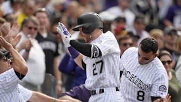 Apr 8, 2016; Denver, CO, USA; Colorado Rockies shortstop Trevor Story (27) celebrates his two run home run in the fourth inning against the San Diego Padres at Coors Field. Mandatory Credit: Ron Chenoy-USA TODAY Sports