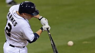 Sep 2, 2015; San Diego, CA, USA; San Diego Padres shortstop Clint Barmes (12) hits a two RBI double during the fourth inning against the Texas Rangers at Petco Park. Mandatory Credit: Jake Roth-USA TODAY Sports