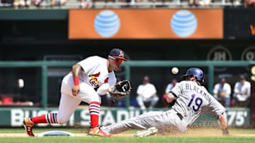 Aug 2, 2015; St. Louis, MO, USA; Colorado Rockies center fielder Charlie Blackmon (19) slides in to second base safely on St. Louis Cardinals second baseman Kolten Wong (16) at Busch Stadium. Mandatory Credit: Jasen Vinlove-USA TODAY Sports