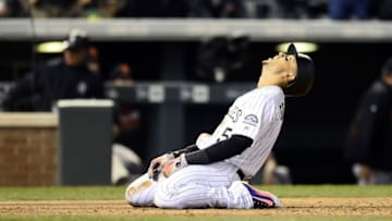 Apr 12, 2016; Denver, CO, USA; Colorado Rockies right fielder Carlos Gonzalez (5) reacts to being tagged out at home by San Francisco Giants catcher Trevor Brown (14) (not pictured) in the fifth inning at Coors Field. Mandatory Credit: Ron Chenoy-USA TODAY Sports