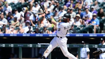 Jun 26, 2016; Denver, CO, USA; Colorado Rockies center fielder Charlie Blackmon (19) hits a solo home run in the third inning at against the Arizona Diamondbacks Coors Field. Mandatory Credit: Ron Chenoy-USA TODAY Sports