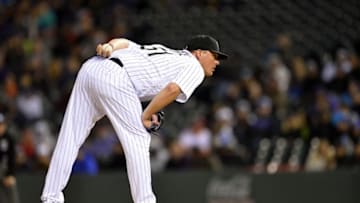 May 14, 2016; Denver, CO, USA; Colorado Rockies relief pitcher Jake McGee (51) looks in for the sign in the ninth inning against the New York Mets against the Colorado Rockies at Coors Field. The Rockies defeated the Mets 7-4. Mandatory Credit: Ron Chenoy-USA TODAY Sports