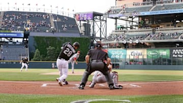 May 31, 2016; Denver, CO, USA; Colorado Rockies third baseman Nolan Arenado (28) hits a two run home run in the first inning against the Cincinnati Reds at Coors Field. Mandatory Credit: Isaiah J. Downing-USA TODAY Sports