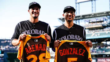 Jul 9, 2016; Denver, CO, USA; Colorado Rockies third baseman Nolan Arenado (28) and right fielder Carlos Gonzalez (5) pose for a photo after being presented with their jerseys for the All-Star Game prior to their game against the Philadelphia Phillies at Coors Field. Mandatory Credit: Isaiah J. Downing-USA TODAY Sports