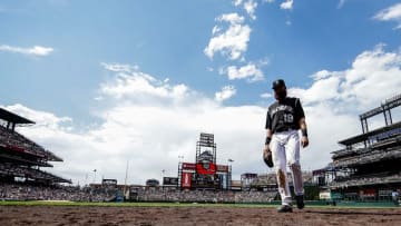 Jul 24, 2016; Denver, CO, USA; Colorado Rockies center fielder Charlie Blackmon (19) walks off the field in the middle of the fourth inning against the Atlanta Braves at Coors Field. Mandatory Credit: Isaiah J. Downing-USA TODAY Sports