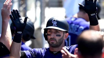 Jul 3, 2016; Los Angeles, CA, USA; Colorado Rockies first baseman Daniel Descalso (3) is greeted in the dugout after a solo home run in the seventh inning of the game against the Los Angeles Dodgers at Dodger Stadium. Dodgers won 4-1. Mandatory Credit: Jayne Kamin-Oncea-USA TODAY Sports