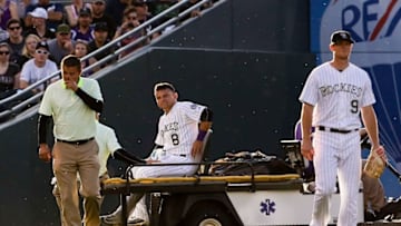 Jun 14, 2016; Denver, CO, USA; Colorado Rockies left fielder Gerardo Parra (8) is carted off the field after a collision in the third inning against the New York Yankees at Coors Field. Mandatory Credit: Isaiah J. Downing-USA TODAY Sports