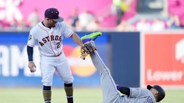 Jul 12, 2016; San Diego, CA, USA; National League outfielder Carlos Gonzalez (5) of the Colorado Rockies is forced out by American League infielder Jose Altuve (27) of the Houston Astros on a fielder's choice in the third inning in the 2016 MLB All Star Game at Petco Park. Mandatory Credit: Gary A. Vasquez-USA TODAY Sports