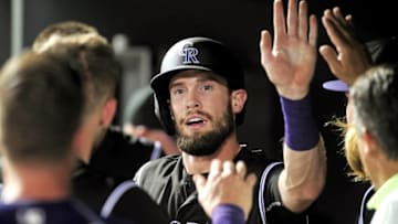 Jul 25, 2016; Baltimore, MD, USA; Colorado Rockies outfielder David Dahl (26) high fives teammates after scoring a run in the seventh inning against the Baltimore Orioles at Oriole Park at Camden Yards. Mandatory Credit: Evan Habeeb-USA TODAY Sports