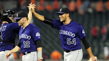 Jul 27, 2016; Baltimore, MD, USA; Colorado Rockies pitcher Carlos Estevez (54) high fives catcher Nick Hundley (4) after beating the Baltimore Orioles 3-1 at Oriole Park at Camden Yards. Mandatory Credit: Evan Habeeb-USA TODAY Sports