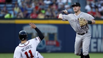 Jul 15, 2016; Atlanta, GA, USA; Colorado Rockies shortstop Trevor Story (27) throws to first base for a double play as Atlanta Braves center fielder Ender Inciarte (11) is out at second base in the second inning of their game at Turner Field. Mandatory Credit: Jason Getz-USA TODAY Sports