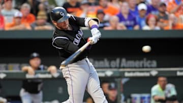 Jul 26, 2016; Baltimore, MD, USA; Colorado Rockies shortstop Trevor Story (27) hits a two run single in the third inning against the Baltimore Orioles at Oriole Park at Camden Yards. Mandatory Credit: Evan Habeeb-USA TODAY Sports