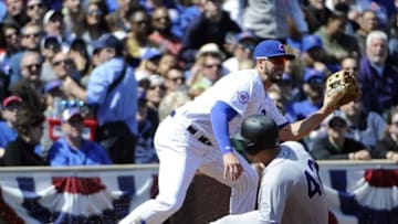 Apr 15, 2016; Chicago, IL, USA; Colorado Rockies third baseman Nolan Arenado (R) slides safely into third base as Chicago Cubs third baseman Kris Bryant (L) waits for the throw during the second inning at Wrigley Field. Mandatory Credit: David Banks-USA TODAY Sports