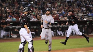Apr 30, 2016; Phoenix, AZ, USA; Colorado Rockies first baseman Ben Paulsen (10) scores a run against the Arizona Diamondbacks during the ninth inning at Chase Field. The Rockies won 5-2. Mandatory Credit: Joe Camporeale-USA TODAY Sports