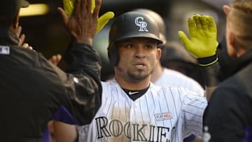 May 14, 2016; Denver, CO, USA; Colorado Rockies left fielder Gerardo Parra (8) celebrates scoring a run in the third inning against the New York Mets at Coors Field. Mandatory Credit: Ron Chenoy-USA TODAY Sports