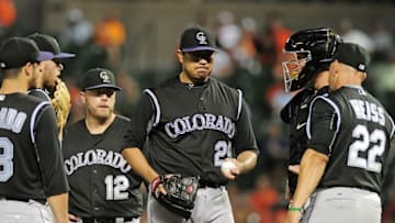Jul 25, 2016; Baltimore, MD, USA; Colorado Rockies pitcher Jorge De La Rosa (29) is removed from the game by manager Walt Weiss (22) in the seventh inning against the Baltimore Orioles at Oriole Park at Camden Yards. Mandatory Credit: Evan Habeeb-USA TODAY Sports