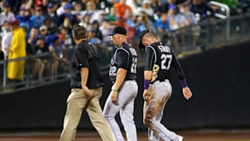 Jul 30, 2016; New York City, NY, USA; Colorado Rockies shortstop Trevor Story (27) leaves the game after being injured while diving for a ball against the New York Mets during the fourth inning at Citi Field. The Rockies won 7-2. Mandatory Credit: Andy Marlin-USA TODAY Sports