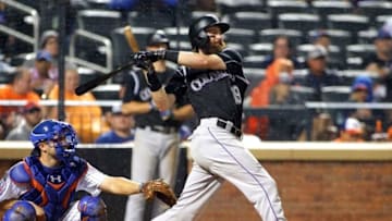 Jul 30, 2016; New York City, NY, USA; Colorado Rockies centerfielder Charlie Blackmon (19) doubles against the New York Mets during the fifth inning at Citi Field. The Rockies won 7-2. Mandatory Credit: Andy Marlin-USA TODAY Sports
