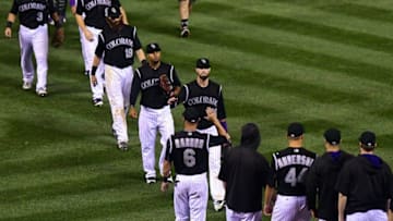 Aug 3, 2016; Denver, CO, USA; Members of the Colorado Rockies celebrate the win over the Los Angeles Dodgers at Coors Field. The Rockies defeated the Dodgers 12-2. Mandatory Credit: Ron Chenoy-USA TODAY Sports
