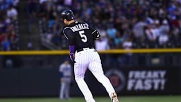 Aug 3, 2016; Denver, CO, USA; Colorado Rockies right fielder Carlos Gonzalez (5) rounds the bases after hitting a two run home run in the sixth inning against the Los Angeles Dodgers at Coors Field. Mandatory Credit: Ron Chenoy-USA TODAY Sports