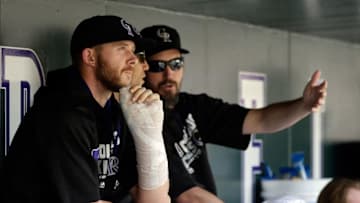 Aug 7, 2016; Denver, CO, USA; Colorado Rockies shortstop Trevor Story (27) looks on looks on from the dugout in the first inning against the Miami Marlins at Coors Field. Mandatory Credit: Isaiah J. Downing-USA TODAY Sports
