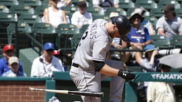 Aug 11, 2016; Arlington, TX, USA; Colorado Rockies first baseman Mark Reynolds (12) is injured after a swing in the seventh inning against the Texas Rangers at Globe Life Park in Arlington. Colorado Rockies won 12-9.Mandatory Credit: Tim Heitman-USA TODAY Sports