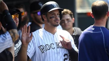 Aug 17, 2016; Denver, CO, USA; Colorado Rockies third baseman Nolan Arenado (28) celebrates scoring a run in the second inning against the Washington Nationals at Coors Field. Mandatory Credit: Ron Chenoy-USA TODAY Sports