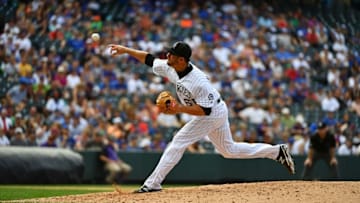 Aug 21, 2016; Denver, CO, USA; Colorado Rockies relief pitcher Matt Carasiti (61) delivers a pitch in the ninth inning against the Chicago Cubs at Coors Field. The Rockies defeated the Cubs 11-4. Mandatory Credit: Ron Chenoy-USA TODAY Sports