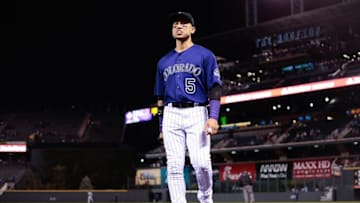 Aug 29, 2016; Denver, CO, USA; Colorado Rockies right fielder Carlos Gonzalez (5) walks to the dugout in the eighth inning against the Los Angeles Dodgers at Coors Field. The Rockies defeated the Dodgers 8-1. Mandatory Credit: Isaiah J. Downing-USA TODAY Sports