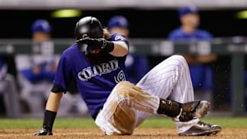 Aug 29, 2016; Denver, CO, USA; Colorado Rockies center fielder Charlie Blackmon (19) falls to the ground in the batters box on a single in the eighth inning against the Los Angeles Dodgers at Coors Field. The Rockies defeated the Dodgers 8-1. Mandatory Credit: Isaiah J. Downing-USA TODAY Sports