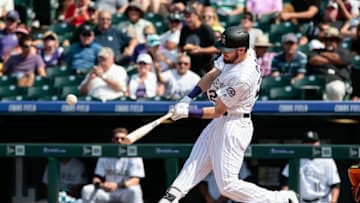 Aug 31, 2016; Denver, CO, USA; Colorado Rockies left fielder David Dahl (26) hits a double against the Los Angeles Dodgers in the sixth inning at Coors Field. Mandatory Credit: Isaiah J. Downing-USA TODAY Sports