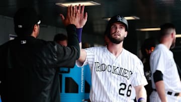 Aug 31, 2016; Denver, CO, USA; Colorado Rockies left fielder David Dahl (26) celebrates with teammates after scoring against the Los Angeles Dodgers in the eighth inning at Coors Field. The Rockies defeated the Dodgers 7-0. Mandatory Credit: Isaiah J. Downing-USA TODAY Sports