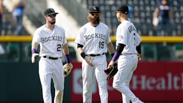 Aug 31, 2016; Denver, CO, USA; Colorado Rockies left fielder David Dahl (26) and center fielder Charlie Blackmon (19) and right fielder Carlos Gonzalez (5) congratulate each other following the game against the Los Angeles Dodgers at Coors Field. The Rockies defeated the Dodgers 7-0. Mandatory Credit: Isaiah J. Downing-USA TODAY Sports