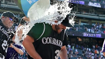 Sep 5, 2016; Denver, CO, USA; Colorado Rockies starting pitcher Chad Bettis (35) is dunked with ice water by catcher Tom Murphy (23) following a win over the San Francisco Giants at Coors Field. Mandatory Credit: Ron Chenoy-USA TODAY Sports