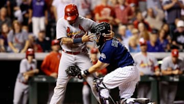 Sep 19, 2016; Denver, CO, USA; Colorado Rockies catcher Nick Hundley (4) tags out St. Louis Cardinals catcher Yadier Molina (4) in the fifth inning at Coors Field. Mandatory Credit: Isaiah J. Downing-USA TODAY Sports